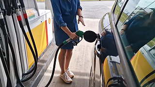 She Is Refueling at the Gas Station, Showing Her Tits and Pussy