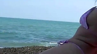 Beach Bikini Bondage in Steel Cuffs