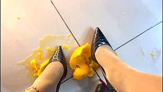 Office Secretary Crushing Balls Oranges in High Heels