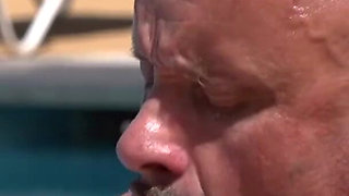 Colored hair babe is pleasing a hard cock with her feet