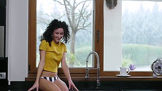 Petite Hungarian babe exposes round tits