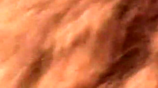 Curly-haired Babe Masturbates with Bottle in Hot Tub