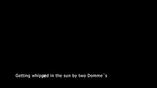 Bruised Slave Getting Whipped by Two Sadists Outside