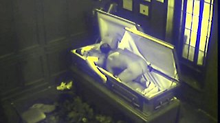 Couple Fucking in Coffin