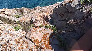 Hot MILF on public beach jerking big cock and fingering pussy