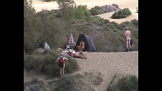Horny nudist couple go all out at the beach