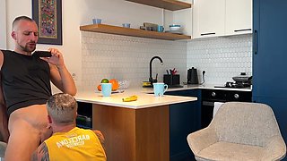 Hot wife is clueless talking to her friend while her husband sucks his cock under the table