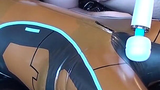 Latex Danielle is attached to the bed and masturbated with the massage vibrator