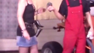 German mechanic men fists customer in the workshop