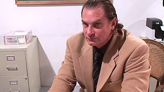 Tattooed dark haired in a classroom with cumshot