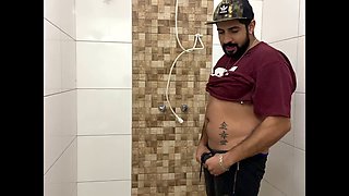 Squirting cum, bearded man with a cap alone in the bathroom having fun in the handjob until he cums a lot - Rodrik Dick