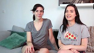 Two dark haired babes share a lesbo kiss