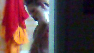 Hidden surveillance in the bathroom of an ebony woman with a nice body