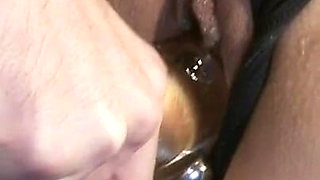 Chained teen enjoys hot wax punishment and dildo penetration