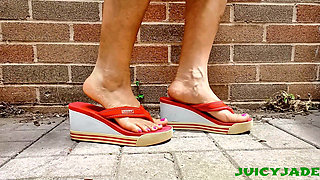 Small Asian Feet in Red Heeled Flip Flops