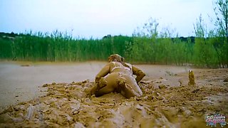 German teen masturbates to orgasm in muddy lake - wet and messy solo fingering