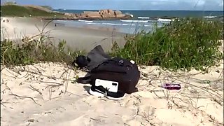 Redhead babe rests on the beach and then massages stranger's cock