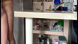Stepmom masturbates in the kitchen with her huge tits