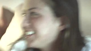 Sexy petite lesbians teasing the camera in a close up