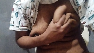 Busty Indian babe playing with her boobs and pussy while peeing