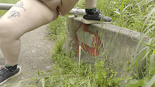 Redhead BBW Pisses Next to a Gate