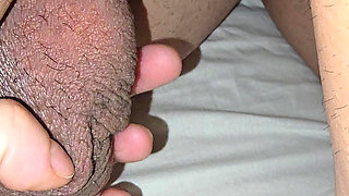 Step mom hand goes under step son leg and grabs his big balls and squeeze them hard