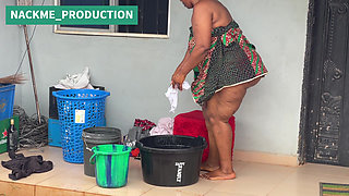 African Mama Multitasks on a Sunday Morning