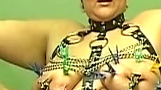 Curvy Redhead MILF Covered in Clothespins and Chains