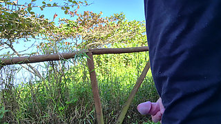 Risky handjob for hot redhead on the walk in the park in public!