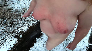 Complete naked busty girl in the snow