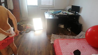 Amateur woman has fun trying on clothes and cutting them.