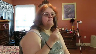 BBW nurse Vicki enjoys eatting a chocolate vanilla ice cream popsiscle