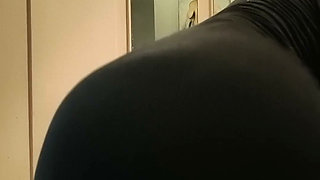 Woman in dress shoves dildo in her pussy