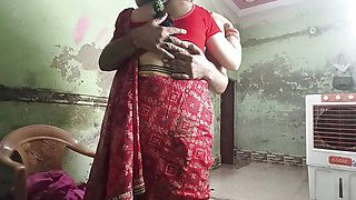 Desi Indian bhabhi in red screen enjoys sex in rainy season.