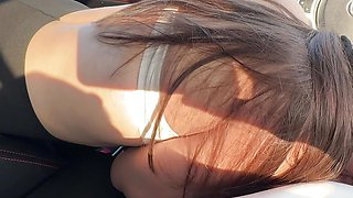 Girl friend fucked in the mouth of a car in a public parking lot